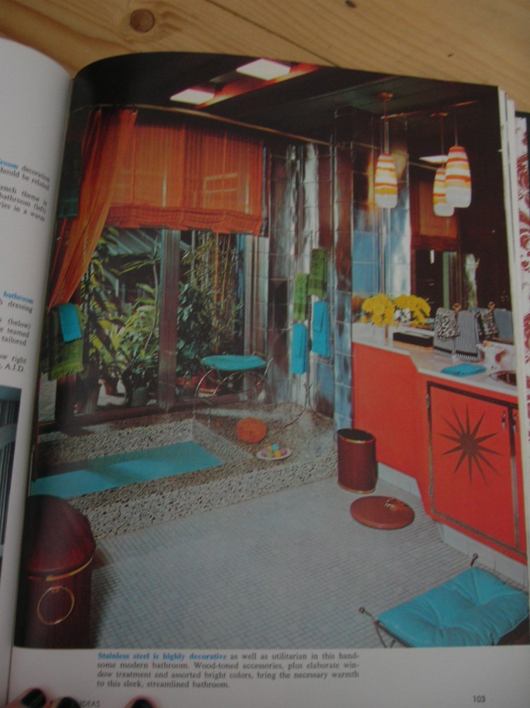 Stainless steel is highly decorative as well as utilitarian in this handsome modern bathroom